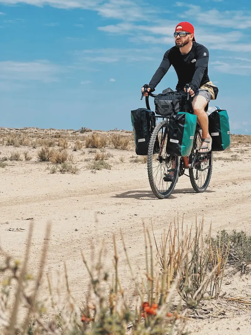 Touring bicycle loaded with panniers on a rural road