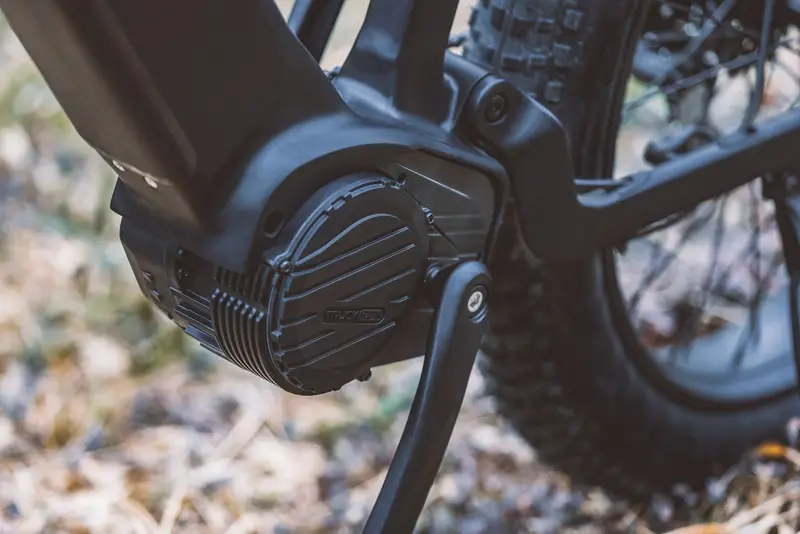 Close-up of an electric bike motor and crank assembly